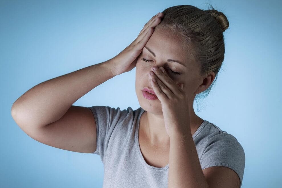 Woman suffering from sinus pain